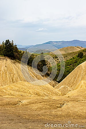 Landscape photo of the soil without vegetation, rough and cracked in the area of â€‹â€‹muddy volcanoes, Buzau, Romania, geological Stock Photo